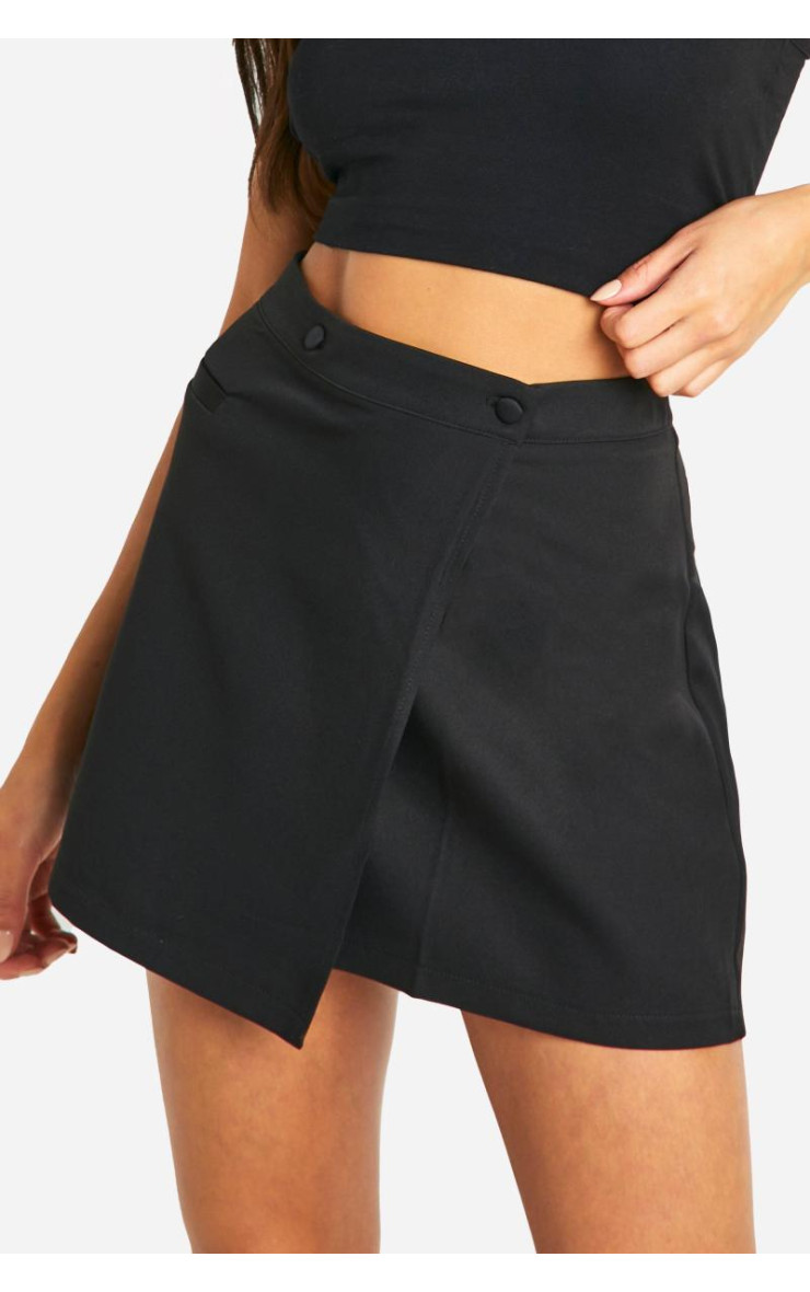 Міні-спідниця з накидкою поверх